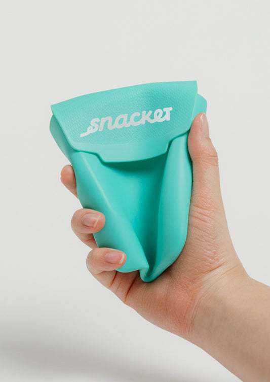 Snacket food pouch aqua squeezed